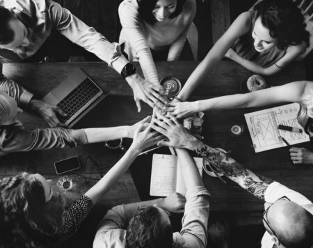 Group of diverse people with joining hands teamwork